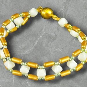 gold-tubelet-bracelet-with-white-shimmer-beads-and-pale-green-metallic-seed-bead-accents-with-gold-magnetic-clasp